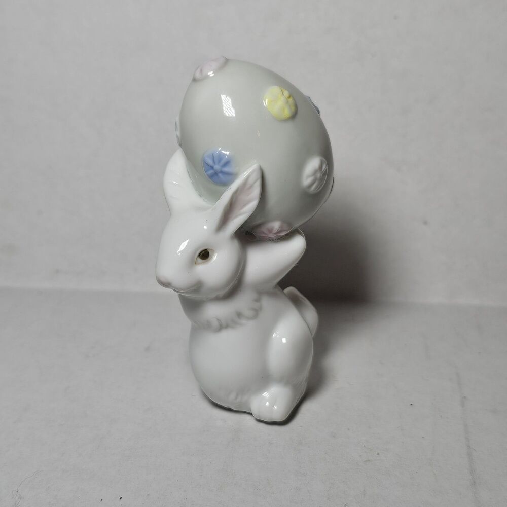 Porcelain Spring Easter Bunny Rabbit Figurine with a Decorated Egg